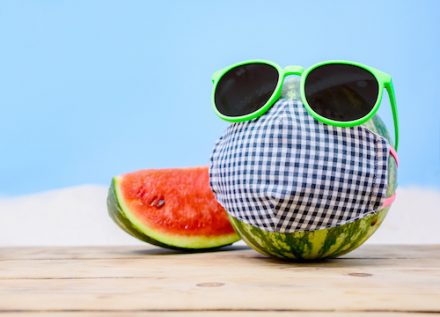 Tropical beach idea when stay home. Creative minimal summer doliday concept with fresh watermelon.